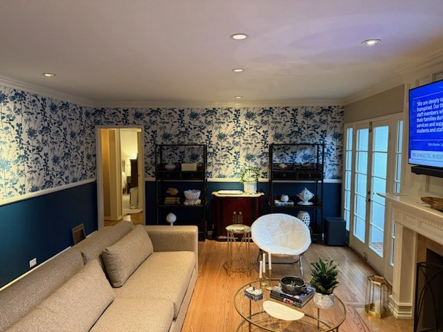Deep blue wallpaper feature wall in a Brooklyn Park living room