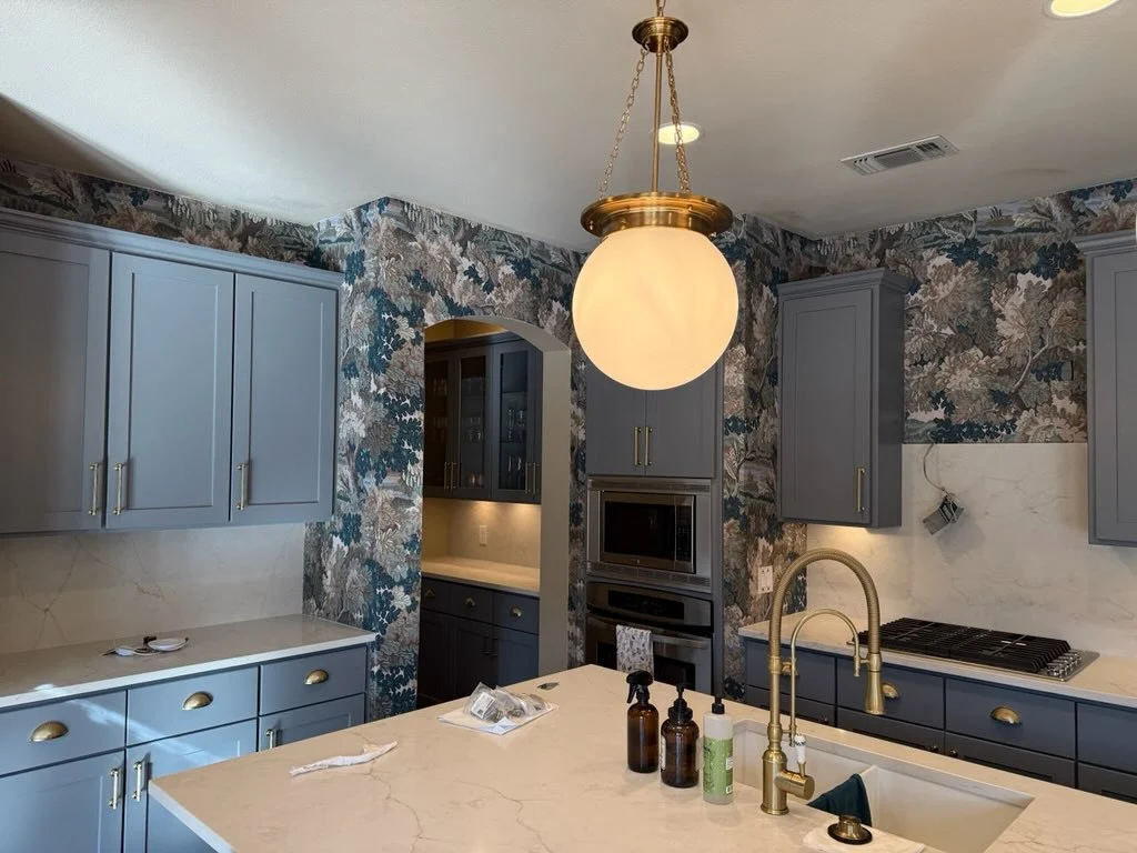 Detailed botanical wallcovering behind a kitchen counter near Linden Hills