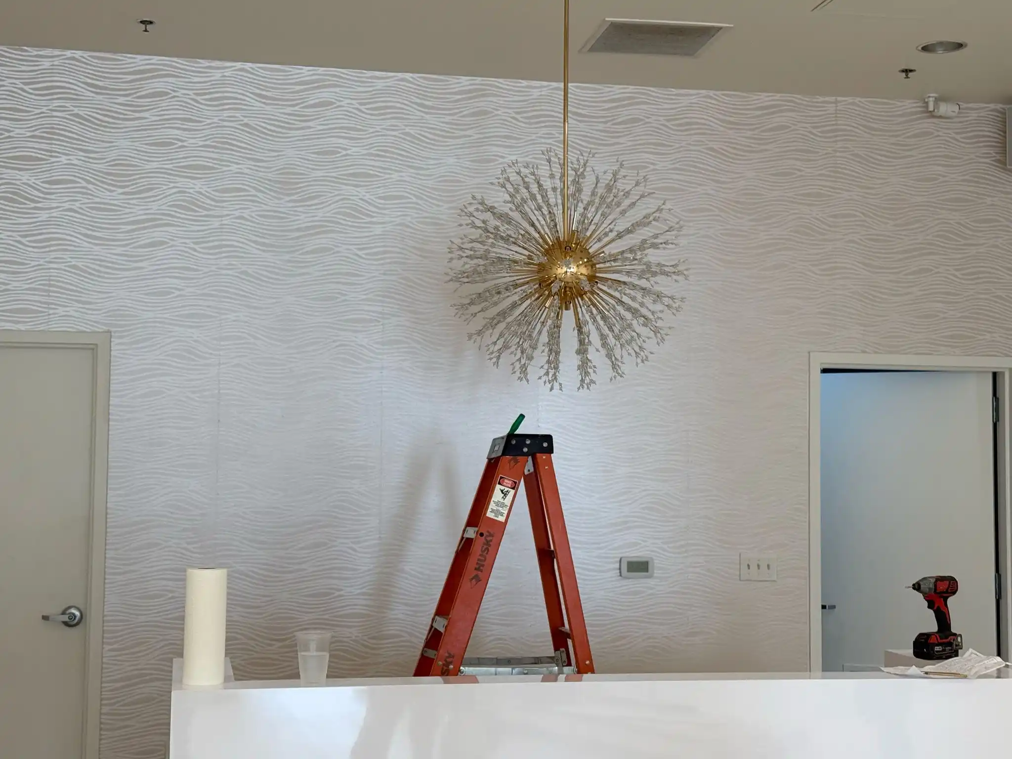 Textured wallcovering accent in a St Cloud residence near Lake George