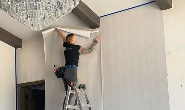 Installer preparing a smooth wall surface in a Bloomington residence