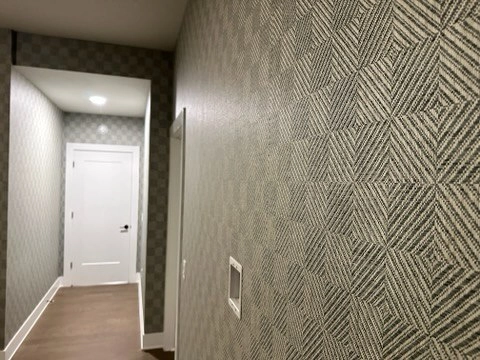 Textured herringbone wallpaper in a hallway near Roseville